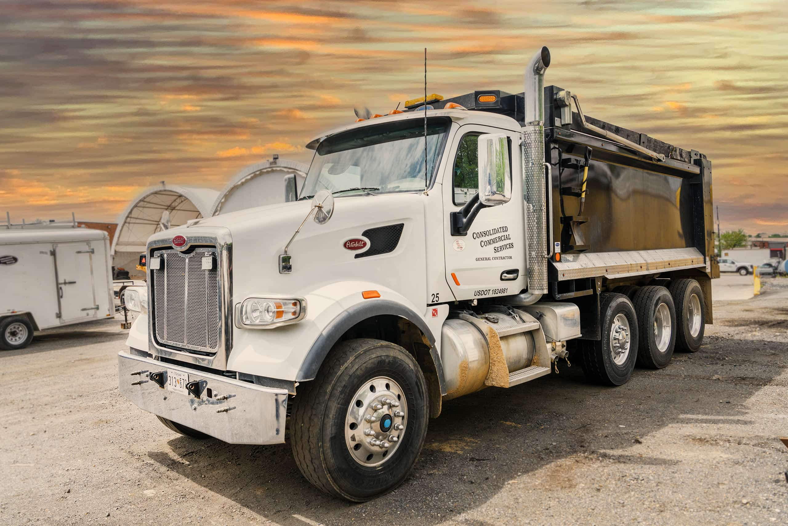 A Consolidated Commercial Services dump truck