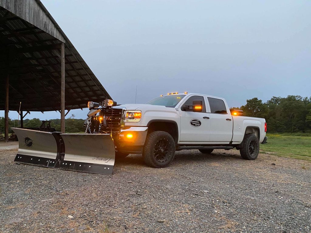 A truck equipped with snow removal equipment