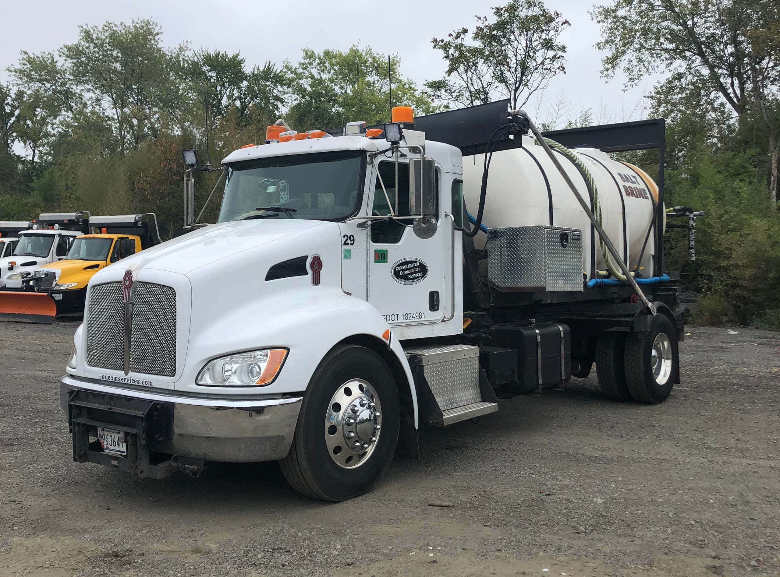 A truck carrying a tank filled with salt brine solution